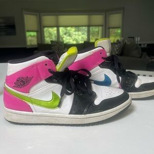 Lightly worn Air Jordan multi colored neon basketball shoes.